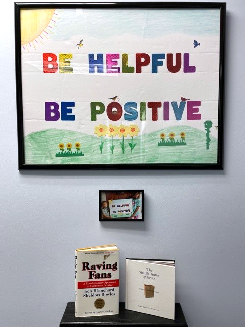 Helpful and Positive poster in office